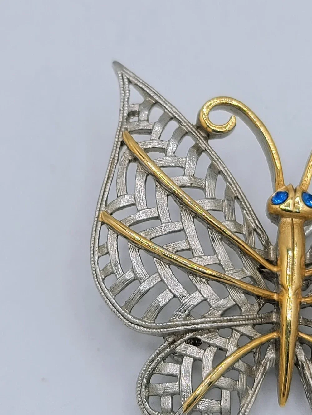 Avon Butterfly Brooch Two Tone Gold Silver Openwork Blue Rhinestone Eyes Vintage
